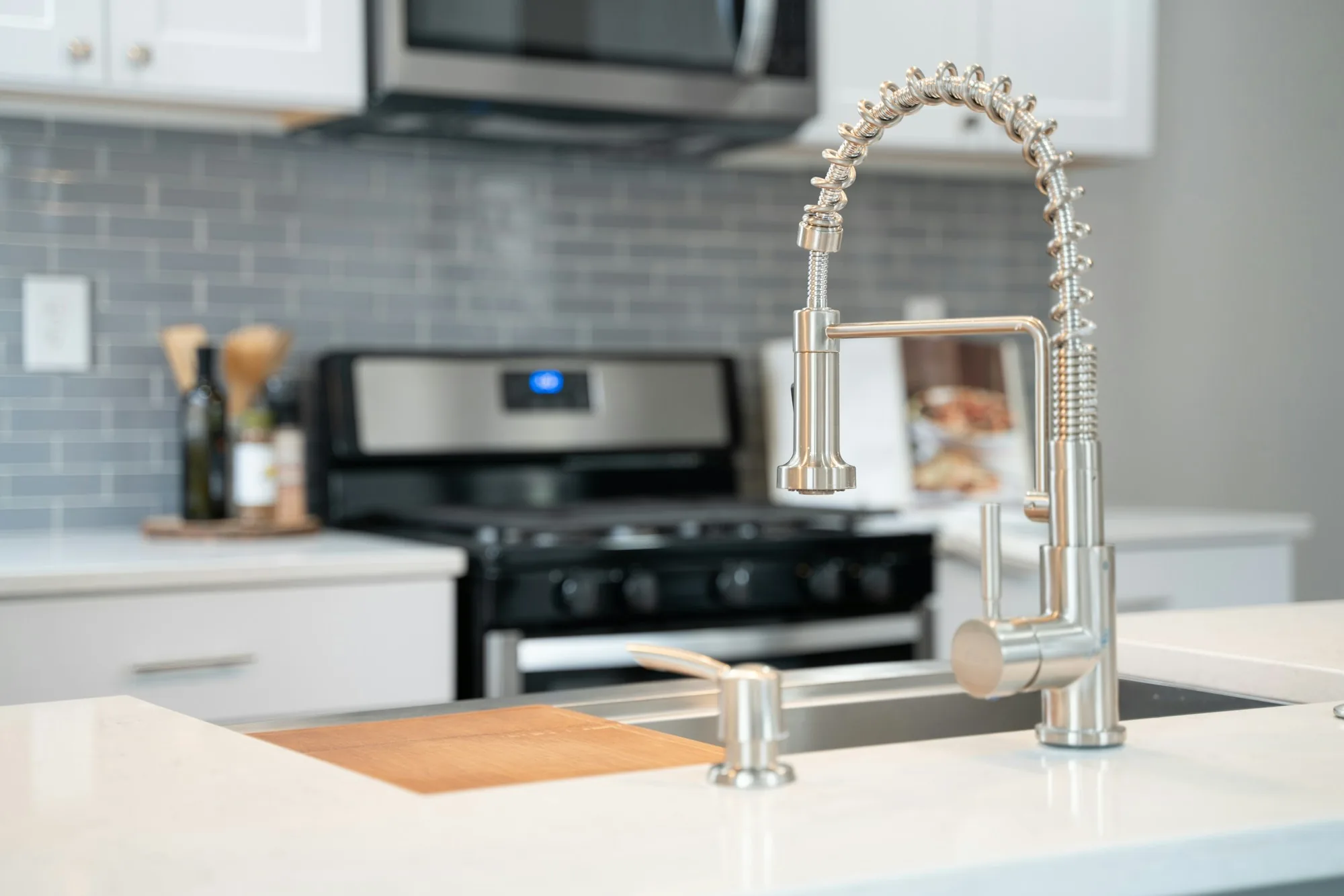 Professional style pull-down faucet in a bright kitchen