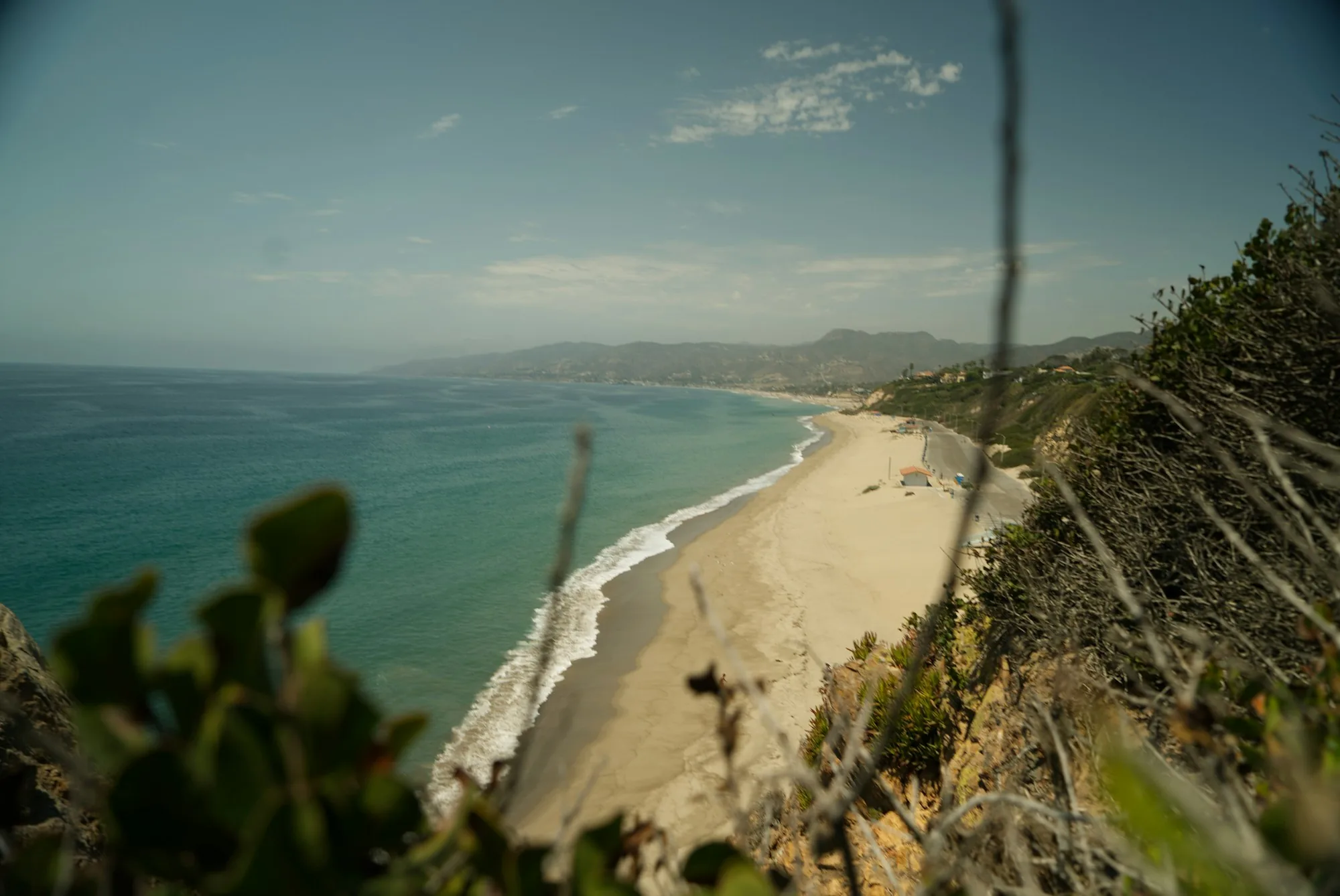 Pacific coastline seen from a bluff on a clear day